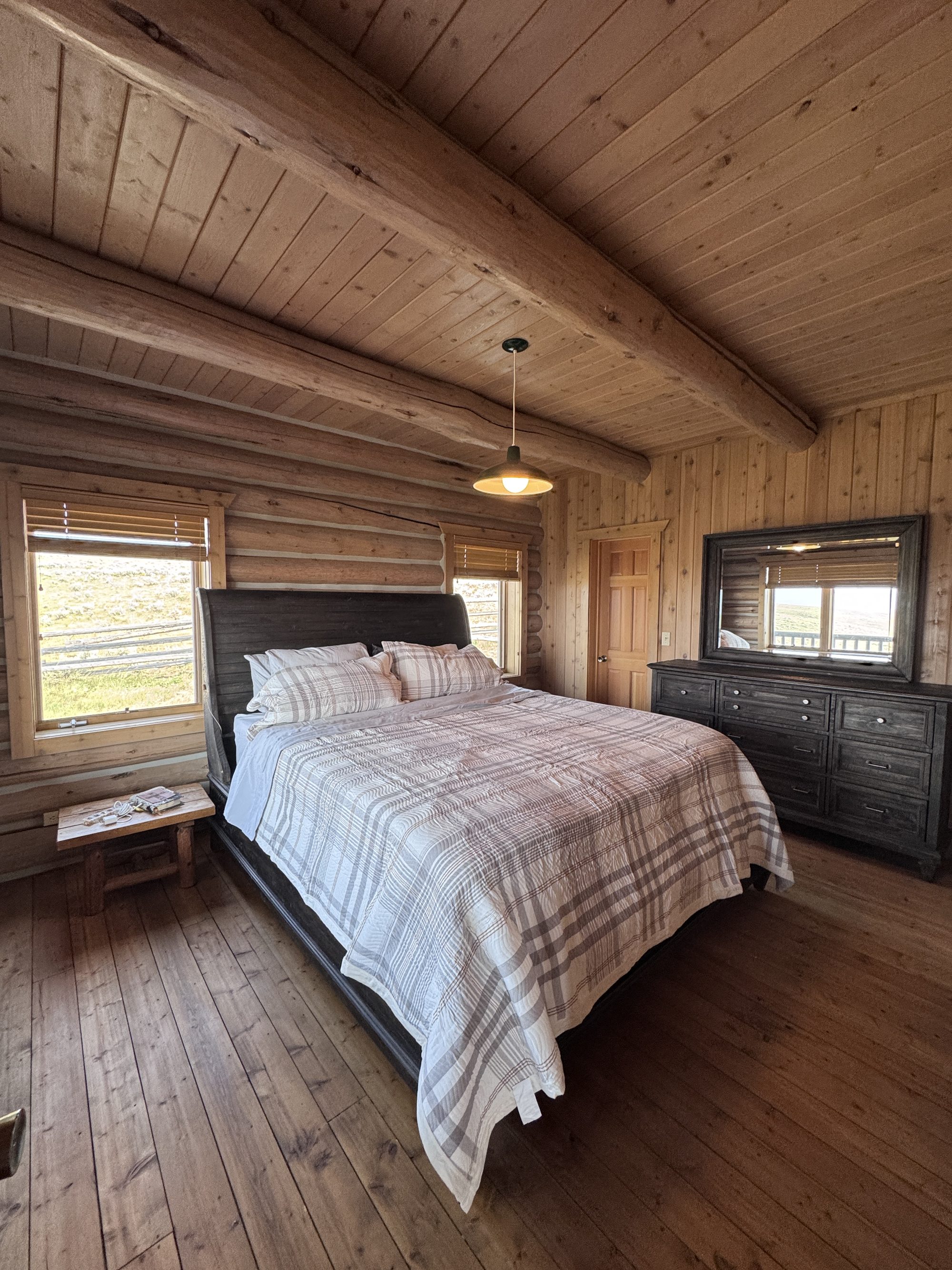 Private bedroom — king sleigh bed with valley-view windows