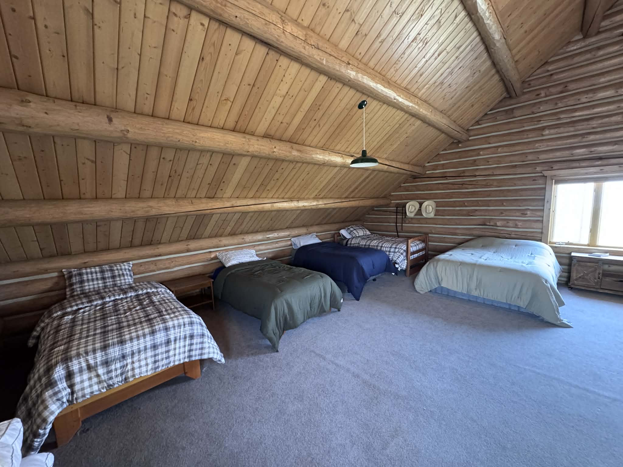 Sleeping loft with twin beds and queen