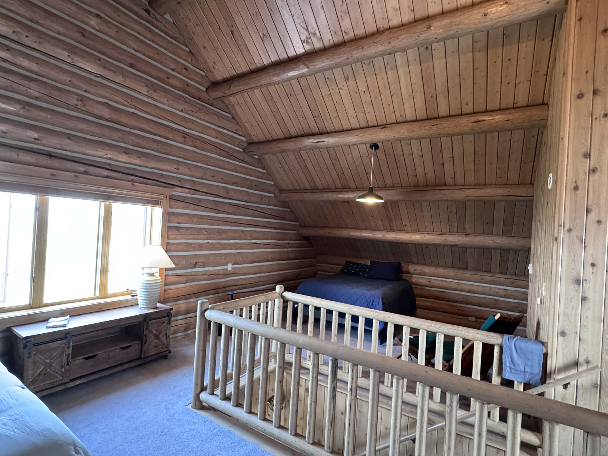 Loft queen bed and stair rail