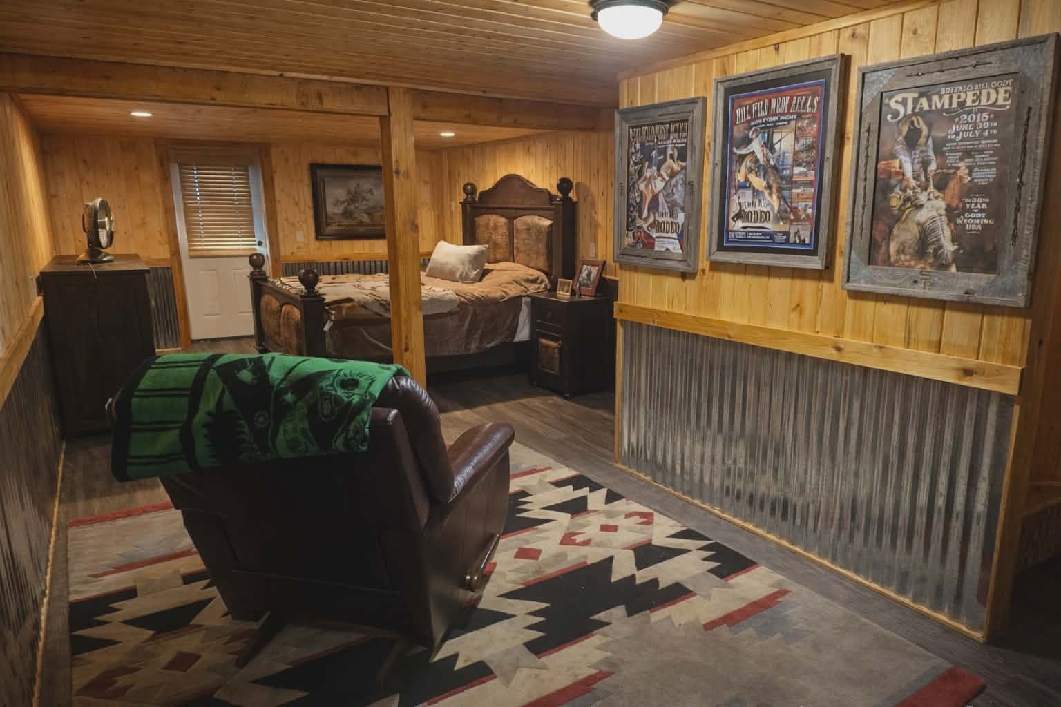 Downstairs bedroom — western suite with rodeo posters and reading chair