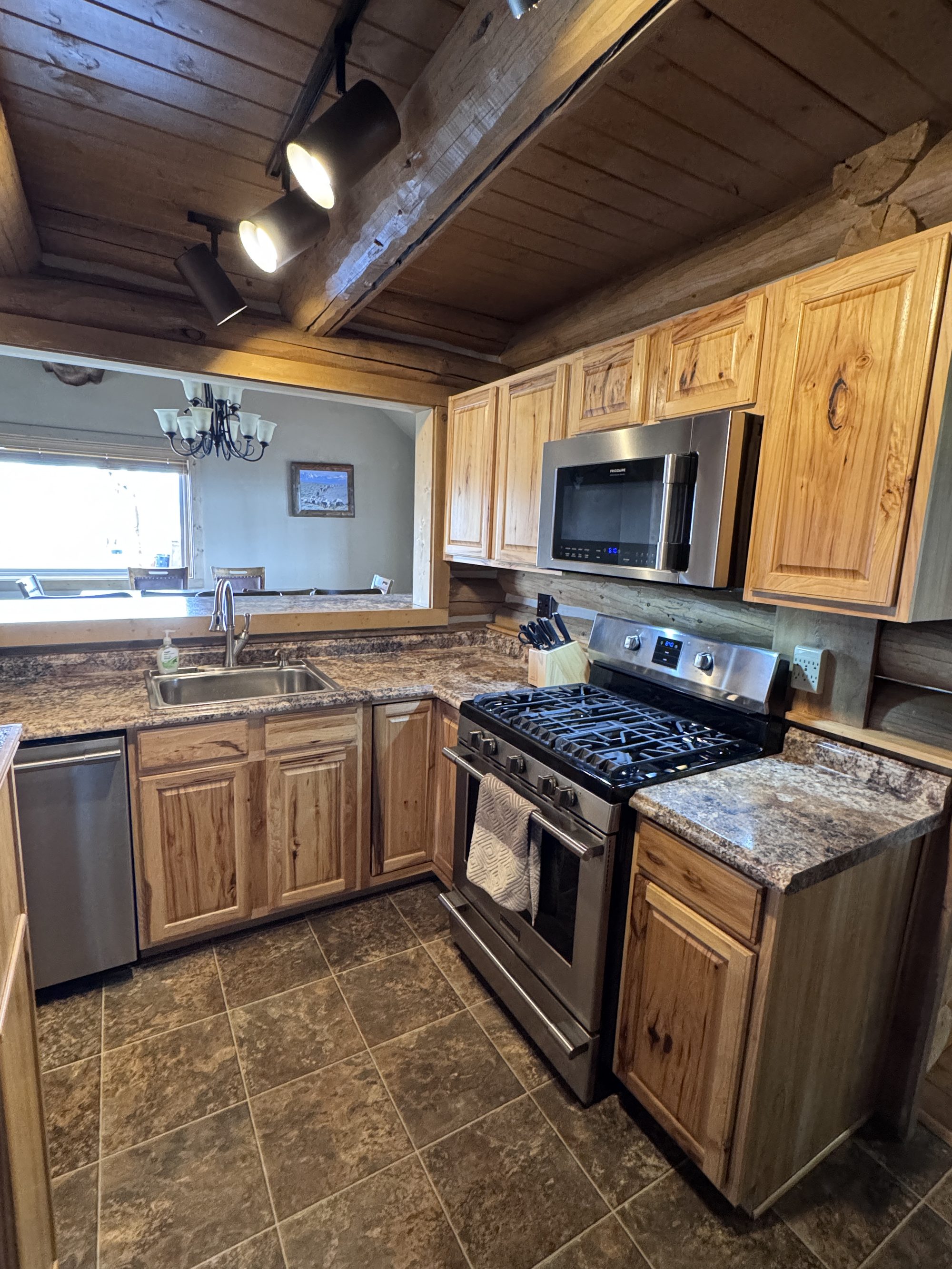 Kitchen island with stacked washer and dryer