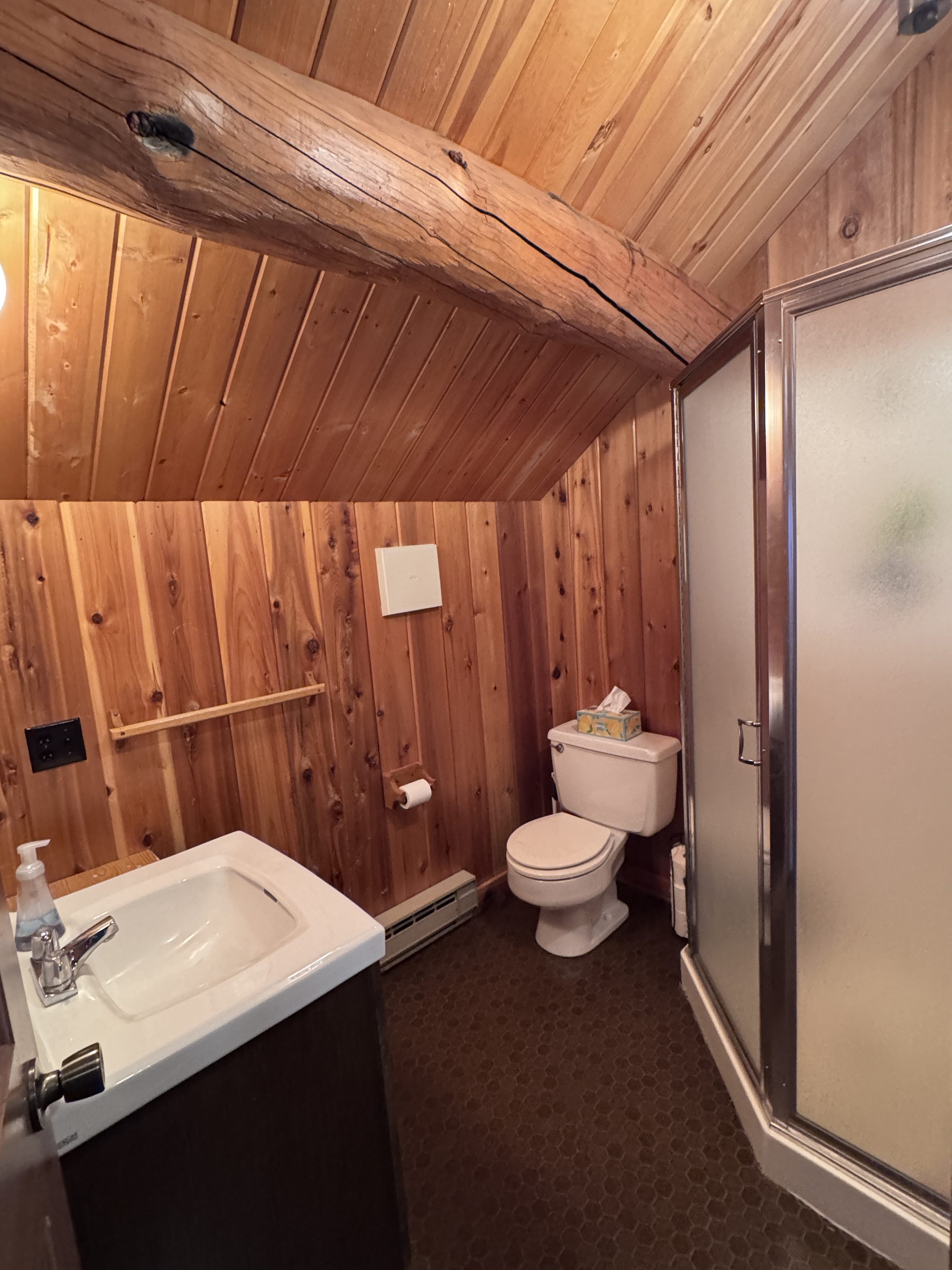 Loft bathroom with corner shower