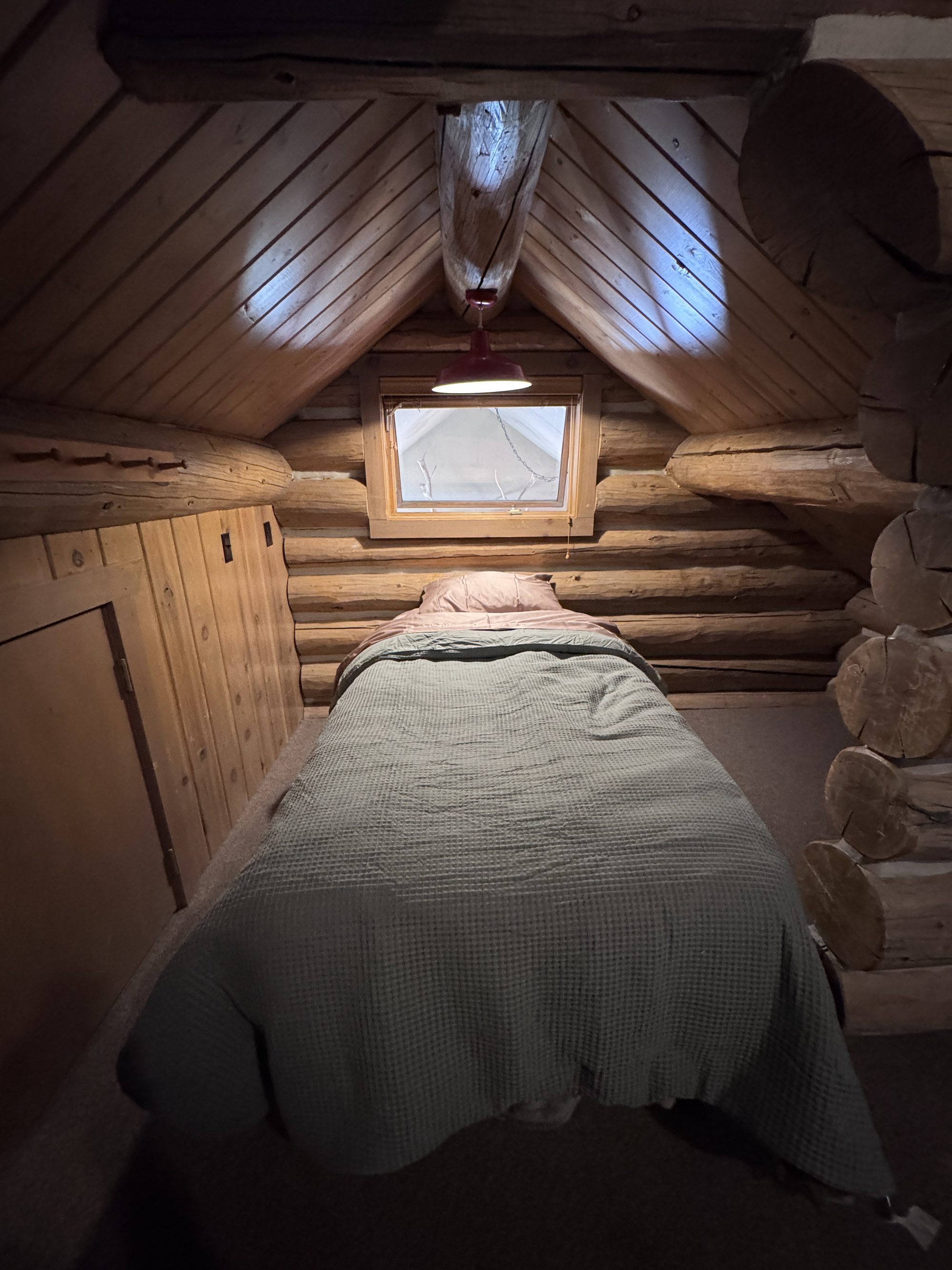 Twin bed nook under the gable window