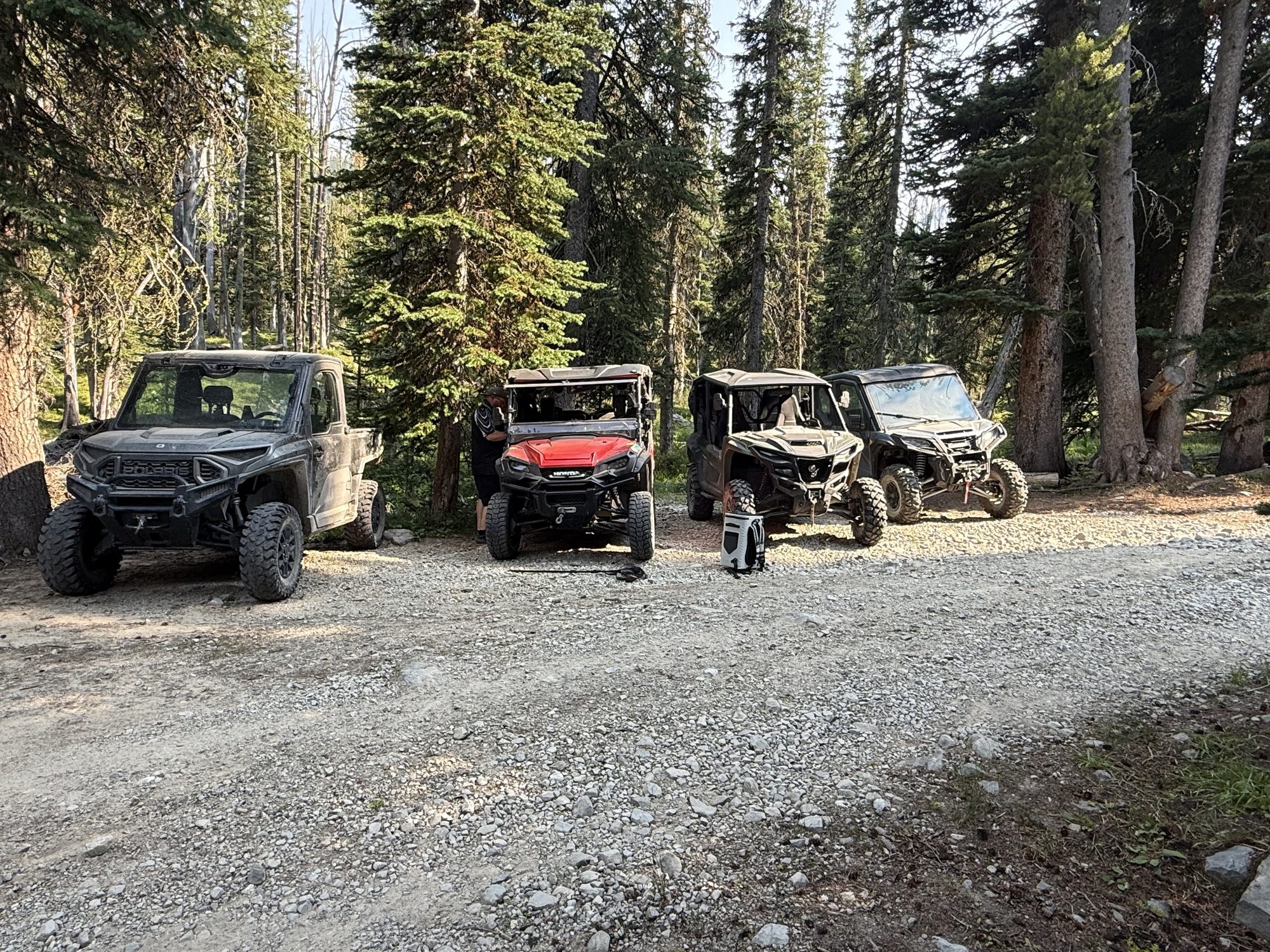 Four machines lined up at a trailhead